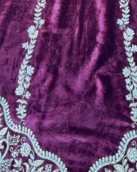 The same velvet suit made in plum with pale aqua embroidery