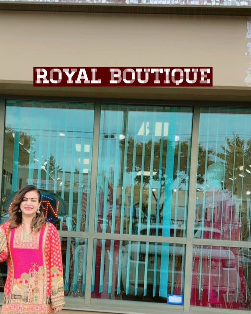 The Royal Boutique storefront sign above large shop windows